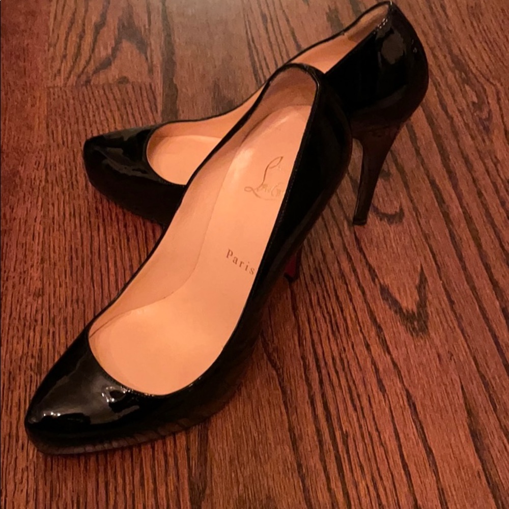 Black Louboutin pumps